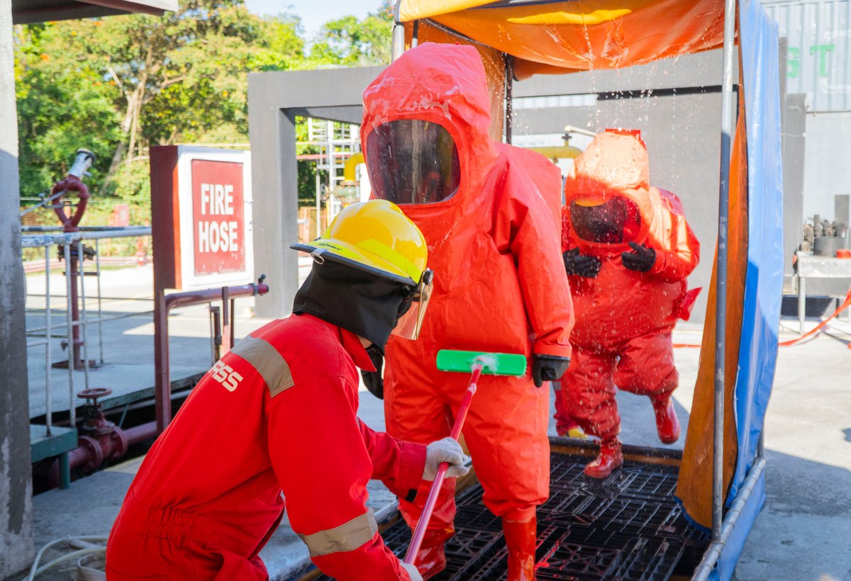 Hazardous materials responders in protective suits